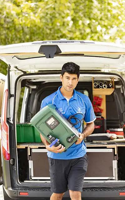 Aqua Works technician arriving with a replacement water pump