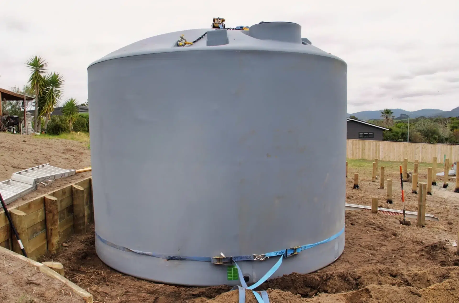 30,000-litre rainwater tank positioned beside a new family home under construction in Mangawhai
