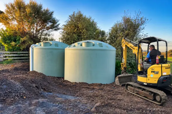 Aqua Works installing two 25,000-litre water tanks with site preparation and digger work