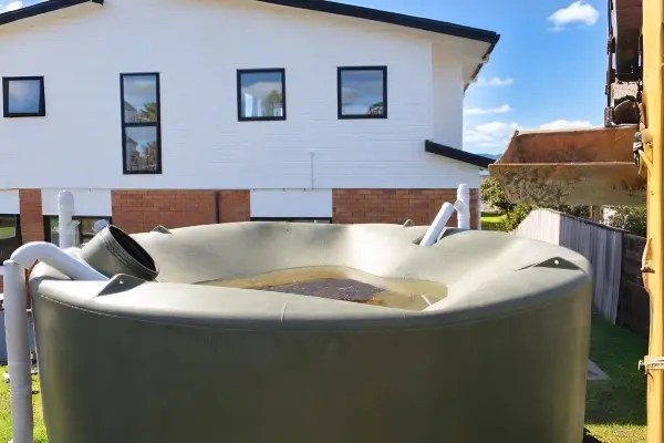 Damaged plastic water tank requiring replacement at a Snells Beach property<br />
