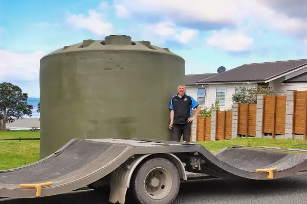 New plastic water tank arriving by transporter for a tank replacement in Snells Beach<br />
