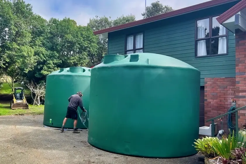 Two connected rainwater tanks increasing household water storage