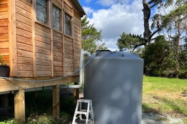 Aqua Works installing a new water tank on a prepared site
