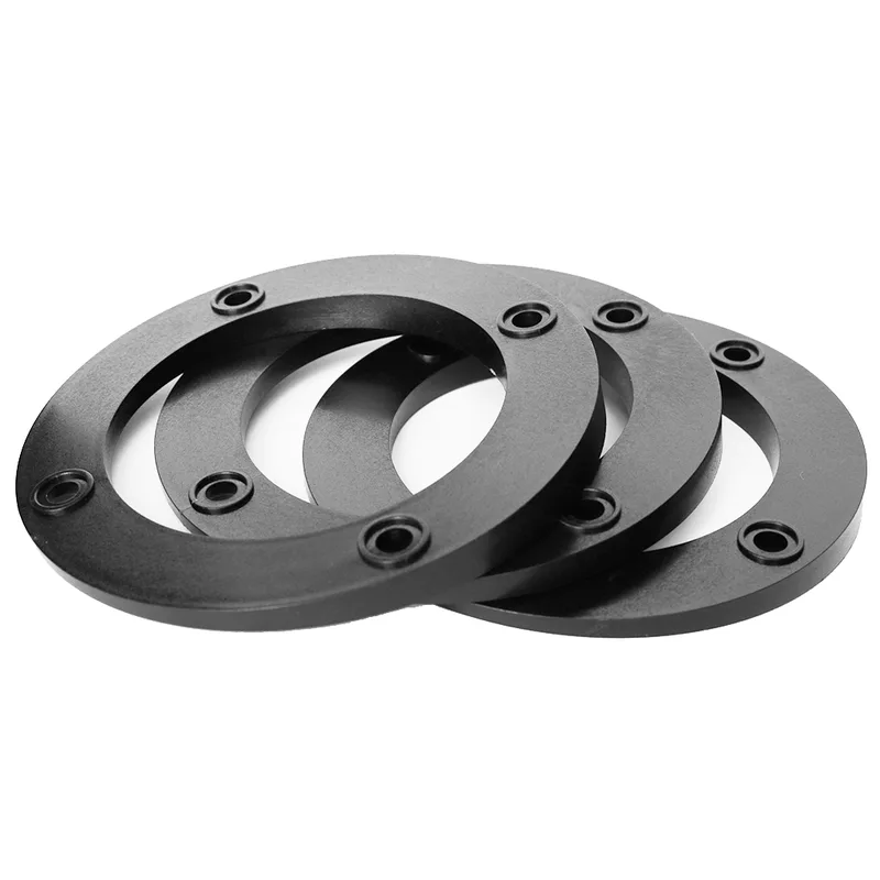 Three black HiLo 4 degree stackable tank monitor levelling shims