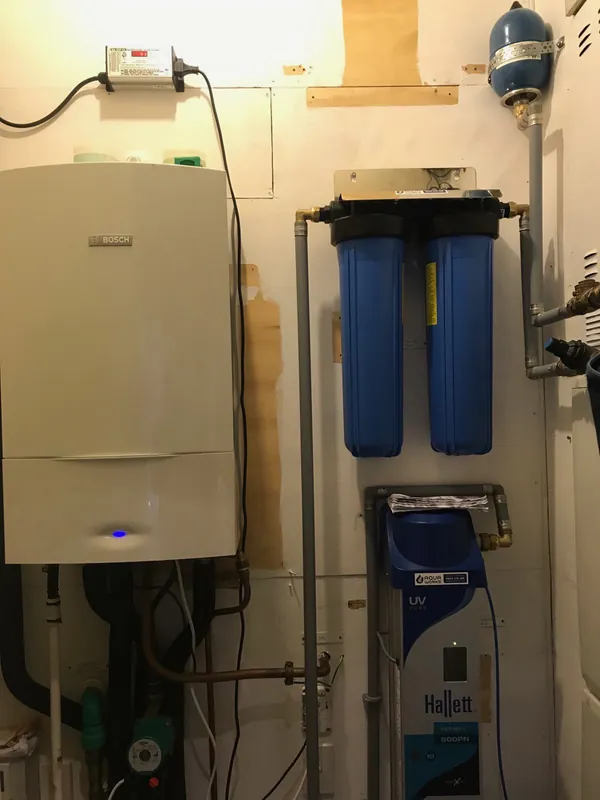 Plant room with a Hallett validated UV system, two large cartridge filters and a pressure tank