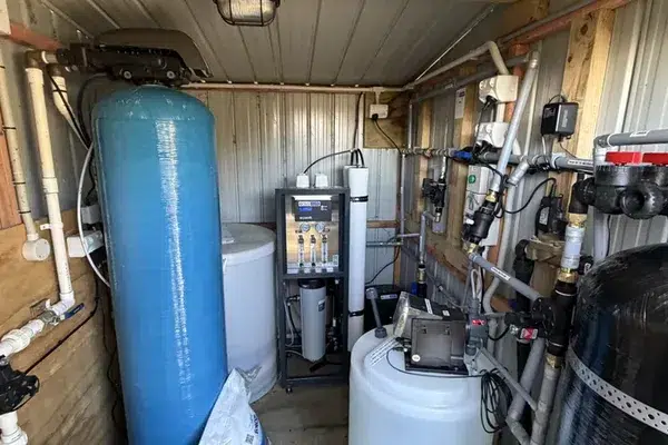 Commercial water treatment shed with a softener, reverse osmosis and UV