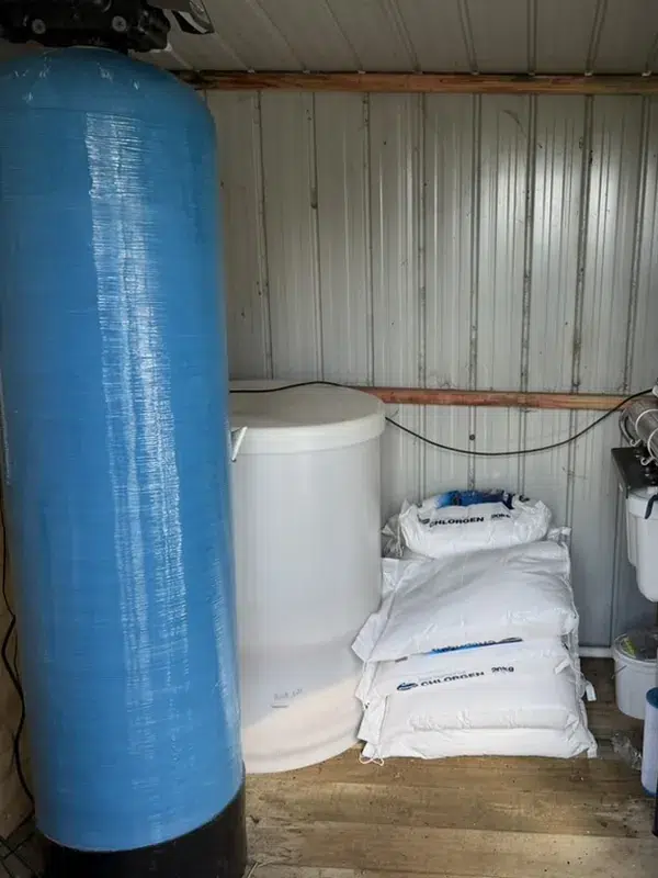 Commercial water softener, brine tank and UV system in a Matakana treatment shed