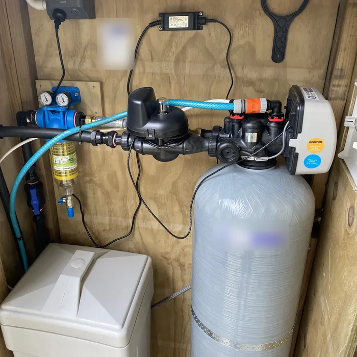 Ecosoft water softener with ECOMIX resin and salt tank in a timber box on a bore water supply