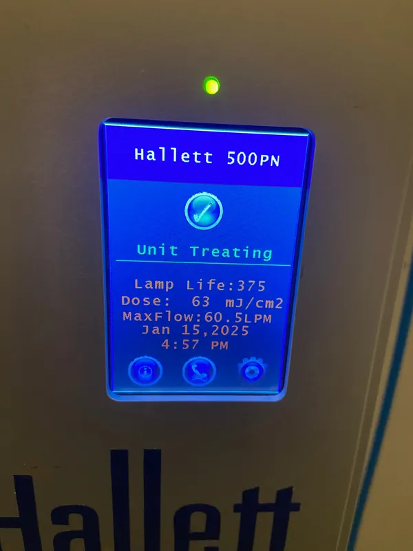 Hallett 500PN UV screen showing Unit Treating and a dose of 63 mJ/cm2