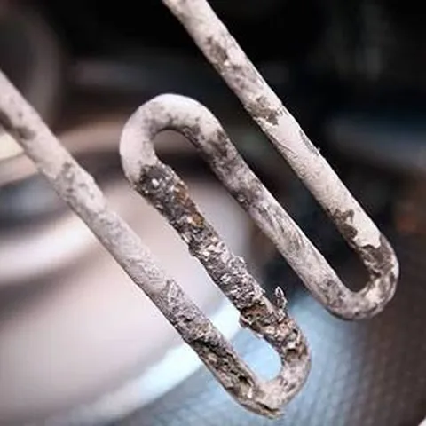 Heating element coated in limescale from hard water