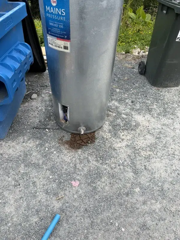 Pile of brown sediment drained from the inlet of an old hot water cylinder